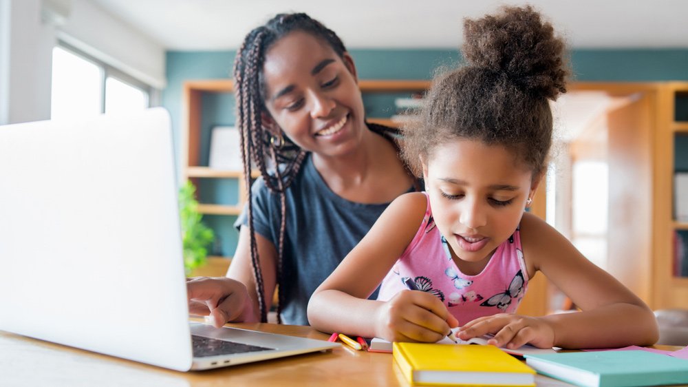 Mother and Daughter working on School work with Seesaw