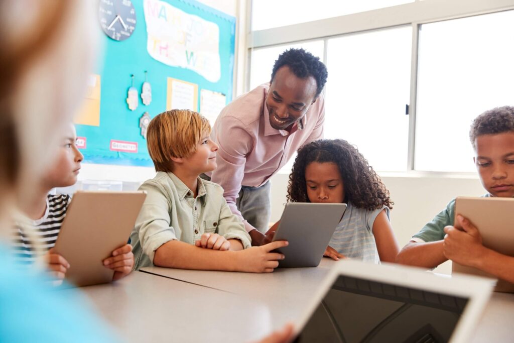 Teacher working with students