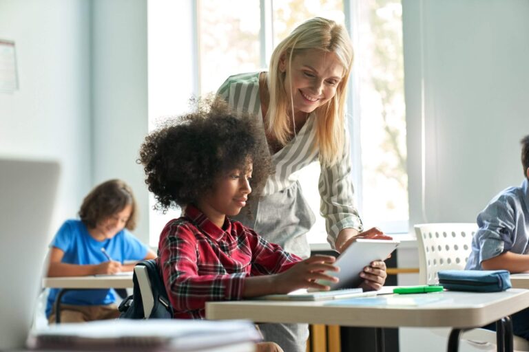 Teacher with students in a classroom