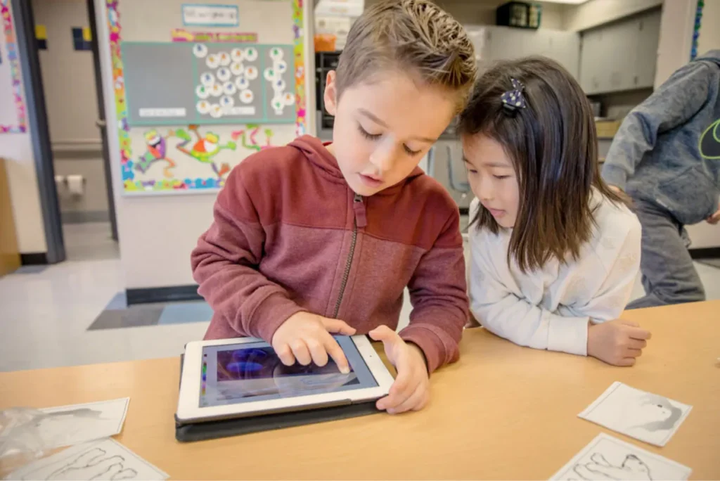 Kids using tablet in classroom